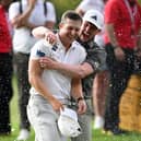 Calum Hill is congratulated by Connor Syme after his play-off win in the Joburg Open at Houghton Golf Club