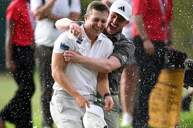 Calum Hill is congratulated by Connor Syme after his play-off win in the Joburg Open at Houghton Golf Club