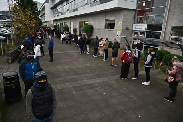 Scots maintain social distancing as they queue for vaccinations at West College Scotland Clydebank Campus in Glasgow in December 2021