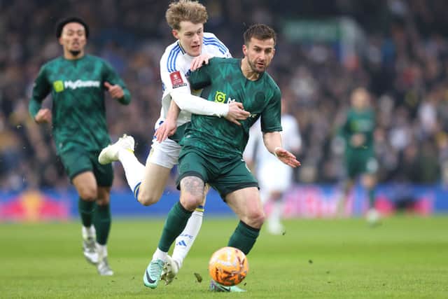 Sam Chambers of Leeds United challenges Joe Bryan of Millwall.