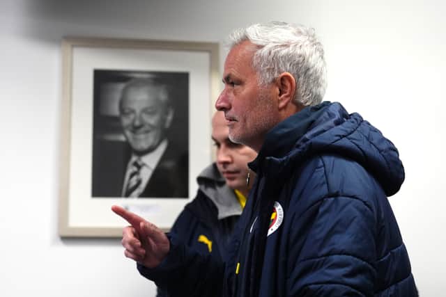 Fenerbahce manager Jose Mourinho walks past a picture of former Rangers manager Walter Smith ahead of a press conference at the Ibrox Stadium.