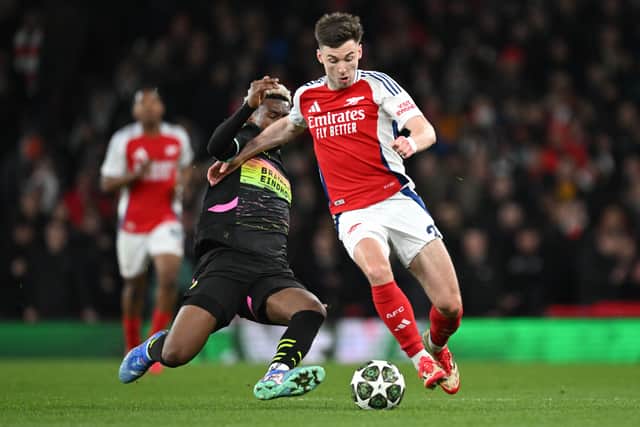 Kieran Tierney of Arsenal is challenged by Adamo Nagalo of PSV Eindhoven during the UEFA Champions League last 16 clash at the Emirates. (Photo by Stuart MacFarlane/Arsenal FC via Getty Images)