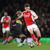Kieran Tierney of Arsenal is challenged by Adamo Nagalo of PSV Eindhoven during the UEFA Champions League last 16 clash at the Emirates. (Photo by Stuart MacFarlane/Arsenal FC via Getty Images)