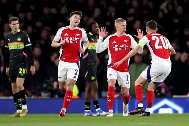 Kieran Tierney (left) joins the celebrations as Oleksandr Zinchenko scores Arsenal's opener in the 2-2 draw with PSV at the Emirates. (Photo by Ryan Pierse/Getty Images)