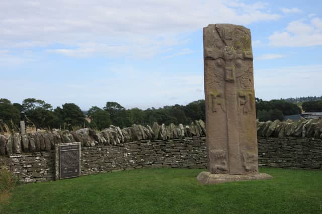 Aberlemno III before it fell over into the dry stane dyke. Some believe the stone, which was revered for the quality of its craftsmanship, stood on the same spot for 1,200 years.