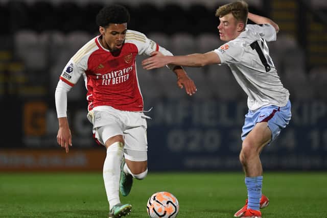 Rory Wilson (R) competes for the ball with Ethan Nwaneri (L) during a PL2 match between Arsenal U21 and Aston Villa U21.