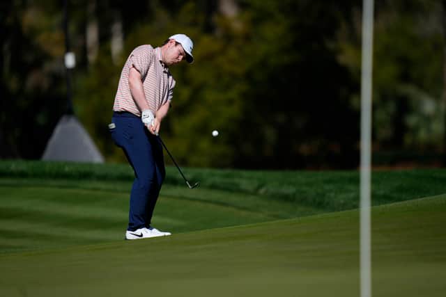 Bob MacIntyre chips onto the seventh green during the first round of The Players Championship at TPC Sawgrass in Ponte Vedra Beach, Florida
