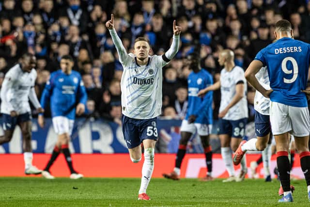 Fenerbahce's Sebastian Szymanski celebrates scoring his side's opener against Rangers at Ibrox. (Photo by Alan Harvey / SNS Group)