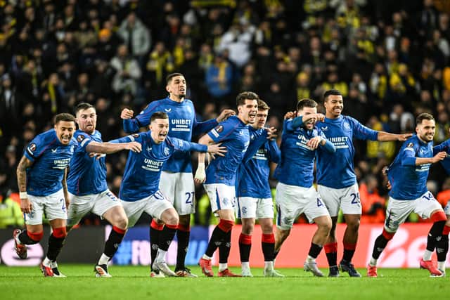 The Rangers squad react to winning the penalty shoout-out against Fenerbahce at Ibrox to progress to the Europa League quarter-finals. (Photo by Rob Casey / SNS Group)
