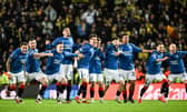 The Rangers squad react to winning the penalty shoout-out against Fenerbahce at Ibrox to progress to the Europa League quarter-finals. (Photo by Rob Casey / SNS Group)