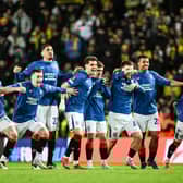 The Rangers squad react to winning the penalty shoout-out against Fenerbahce at Ibrox to progress to the Europa League quarter-finals. (Photo by Rob Casey / SNS Group)