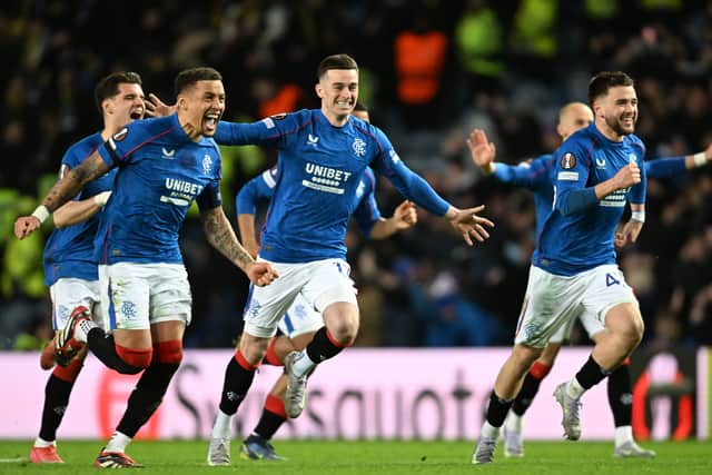 Rangers' Ianis Hagi, James Tavernier, Tom Lawrence and Nicolas Raskin celebrate as they win the penalty shoot-out against Fenerbahce to reach the Europa League quarter-finals. (Photo by Rob Casey / SNS Group)