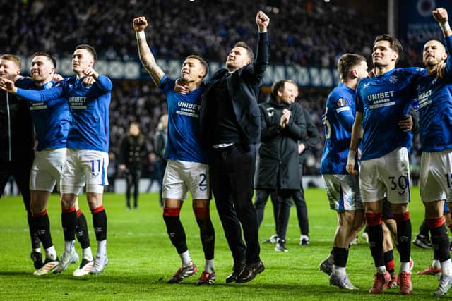 Rangers interim head coach Barry Ferguson celebrates with James Tavernier in front of the fans.