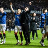 Rangers interim head coach Barry Ferguson celebrates with James Tavernier in front of the fans.