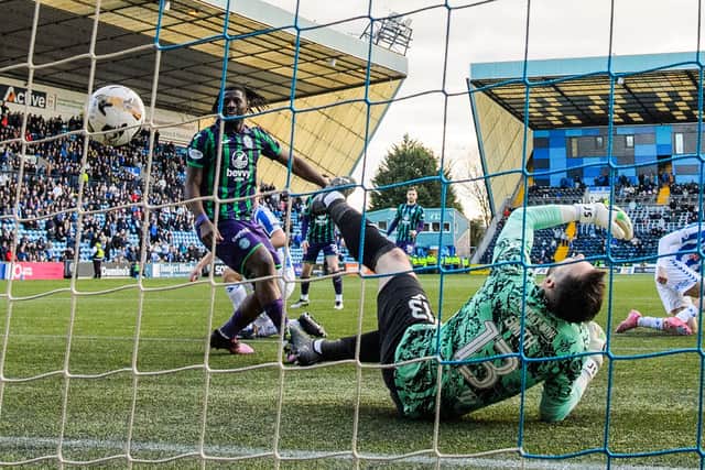 Hibs keeper Jordan Smith despairs after Fraser Murray's effort deflects in.