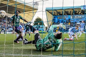 Hibs keeper Jordan Smith despairs after Fraser Murray's effort deflects in.