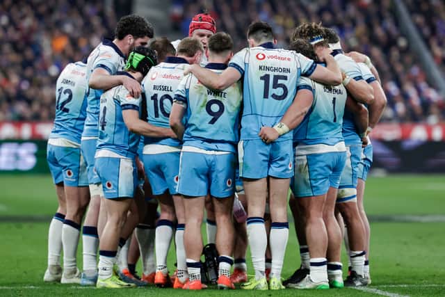 Scotland players form a huddle during the defeat to France in Paris.