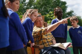 Jamie Oliver reads extracts from his book, Billy and the Epic Escape, during a visit to a  school in Essex