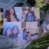 One of many floral tributes left at the house in Bushey, Hertfordshire, where Carol Hunt, 61, and two of her daughters, Hannah, 28, and Louise, 25, were murdered by Kyle Clifford (Picture: Jonathan Brady)