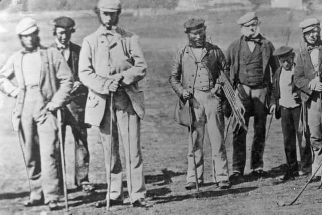 Golfers Captain Hay Wemyss (r), 'Old' Tom Morris (l), and Allan Robertson with his clubs under his arm (c) at St Andrews in the 19th century. Picture: Hulton Archive/Getty Images