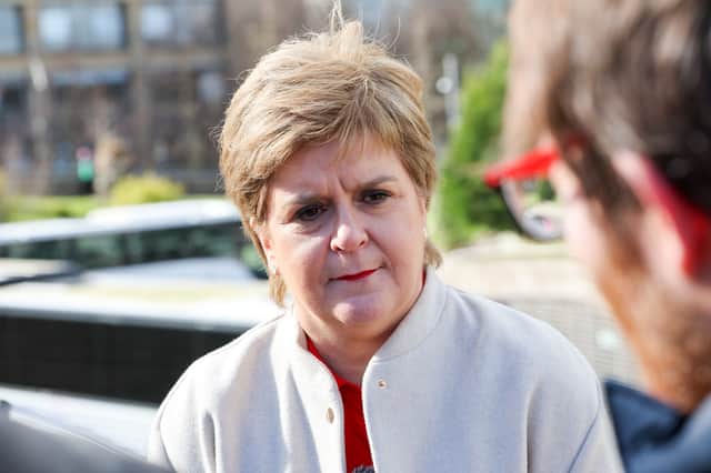Nicola Sturgeon speaks to the media after announcing she will not stand for re-election to the Scottish Parliament next year (Picture: Robert Perry)