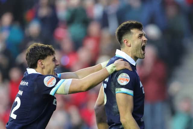 Scotland's Blair Kinghorn celebrates scoring a try against Wales.