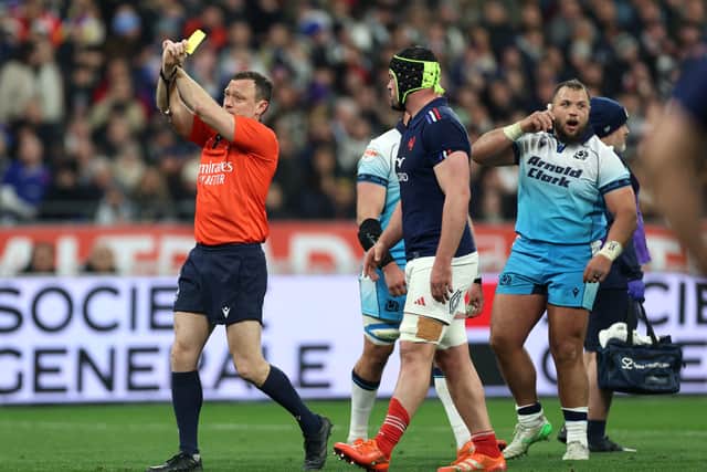 France captain Gregory Alldritt looks on as referee Matthew Carley shows a yellow card to Peato Mauvaka ( out of picture).