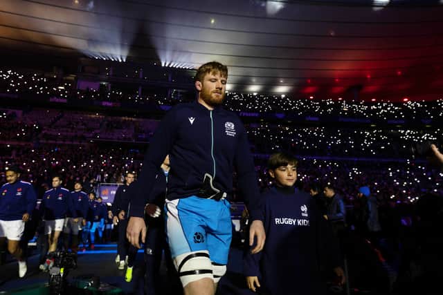 Gregor Brown runs out at the Stade de France for his first Six Nations start for Scotland.