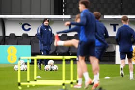Scotland head coach Steve Clarke (left) watches on during a training session at Lesser Hampden, Glasgow. Picture date: Monday March 17, 2025.