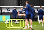 Scotland head coach Steve Clarke (left) watches on during a training session at Lesser Hampden, Glasgow. Picture date: Monday March 17, 2025.