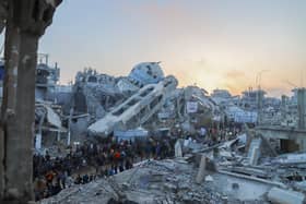 Palestinians join the Iftar gathering next to the rubble of a destroyed mosque in Beit Lahia, Northern Gaza. Picture: Saeed Jaras/Middle East Images/AFP via Getty Images