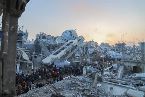 Palestinians join the Iftar gathering next to the rubble of a destroyed mosque in Beit Lahia, Northern Gaza. Picture: Saeed Jaras/Middle East Images/AFP via Getty Images