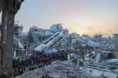Palestinians join the Iftar gathering next to the rubble of a destroyed mosque in Beit Lahia, Northern Gaza. Picture: Saeed Jaras/Middle East Images/AFP via Getty Images