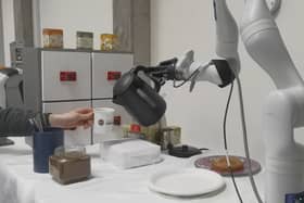 Researchers at the University of Edinburgh unveil the world's first AI-powered robot arm capable of making coffee.