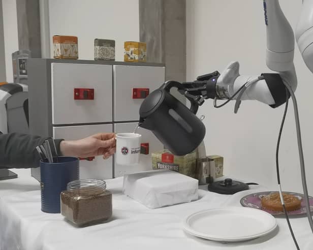 Researchers at the University of Edinburgh unveil the world's first AI-powered robot arm capable of making coffee.