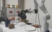 Researchers at the University of Edinburgh unveil the world's first AI-powered robot arm capable of making coffee.