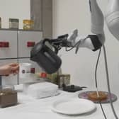 Researchers at the University of Edinburgh unveil the world's first AI-powered robot arm capable of making coffee.