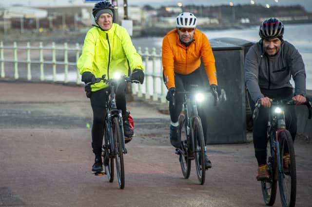 Alastair Dalton rides along Portobello Promenade with round-the-world record cycling holder Mark Beaumont and Markus Stitz during the Edinburgh Dawn Patrol