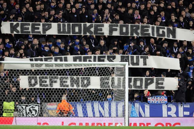 Rangers fans hold up banners in the stands during the UEFA Europa League round of sixteen second leg match at Ibrox Stadium, Glasgow.