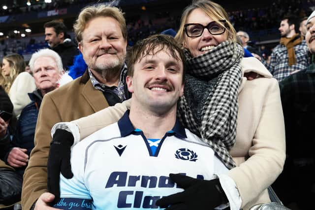 Scotland's Ben Muncaster with family after the match against France in Paris.