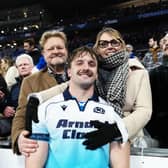 Scotland's Ben Muncaster with family after the match against France in Paris.