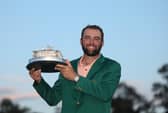 Scottie Scheffler poses with the trophy after winning the 2024 Masters Tournament at Augusta National Golf Club