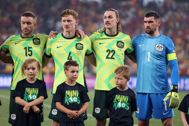 Adam Taggart, Kye Rowles, Jackson Irvine and Mat Ryan of Australia line up for national anthems during the round three FIFA 2026 World Cup AFC Asian Qualifier match between Australia Socceroos and Indonesia. Cr: Getty Images.