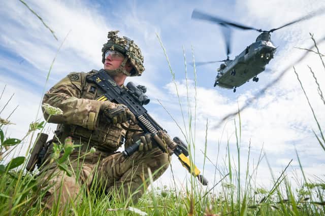 The UK needs to increase its defence capabilities, but it's wrong to cut benefits to do so (Picture: Leon Neal)