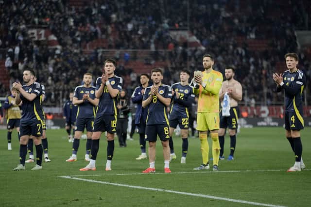 Scotland players greet fans at the end of the Nations League play off first leg win over Greece. (AP Photo/Petros Giannakouris)