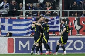 Scotland's Scott McTominay celebrates with teammates after scoring the opening goal during the Nations League play off first leg against Greece at the Georgios Karaiskakis stadium. (AP Photo/Petros Giannakouris)