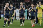 Scotland players greet fans at the end of the Nations League play off first leg win over Greece. (AP Photo/Petros Giannakouris)