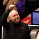 John Higgins is through to the quarter finals of the Players Championship.
