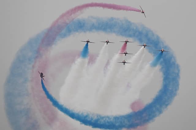 Given the seriousness of our times, it may not be possible to retain the RAF Red Arrows display team, seen performing over Athens last year (Picture: Theophile Bloudanis)