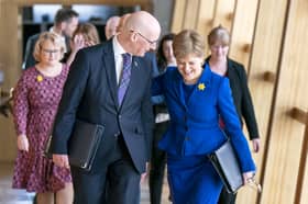 John Swinney and Nicola Sturgeon pictured in Holyrood in 2023